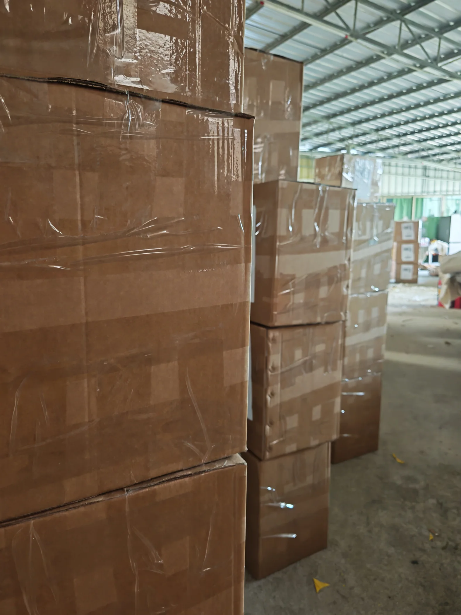 Rows of sealed cartons inside the WanHu warehouse